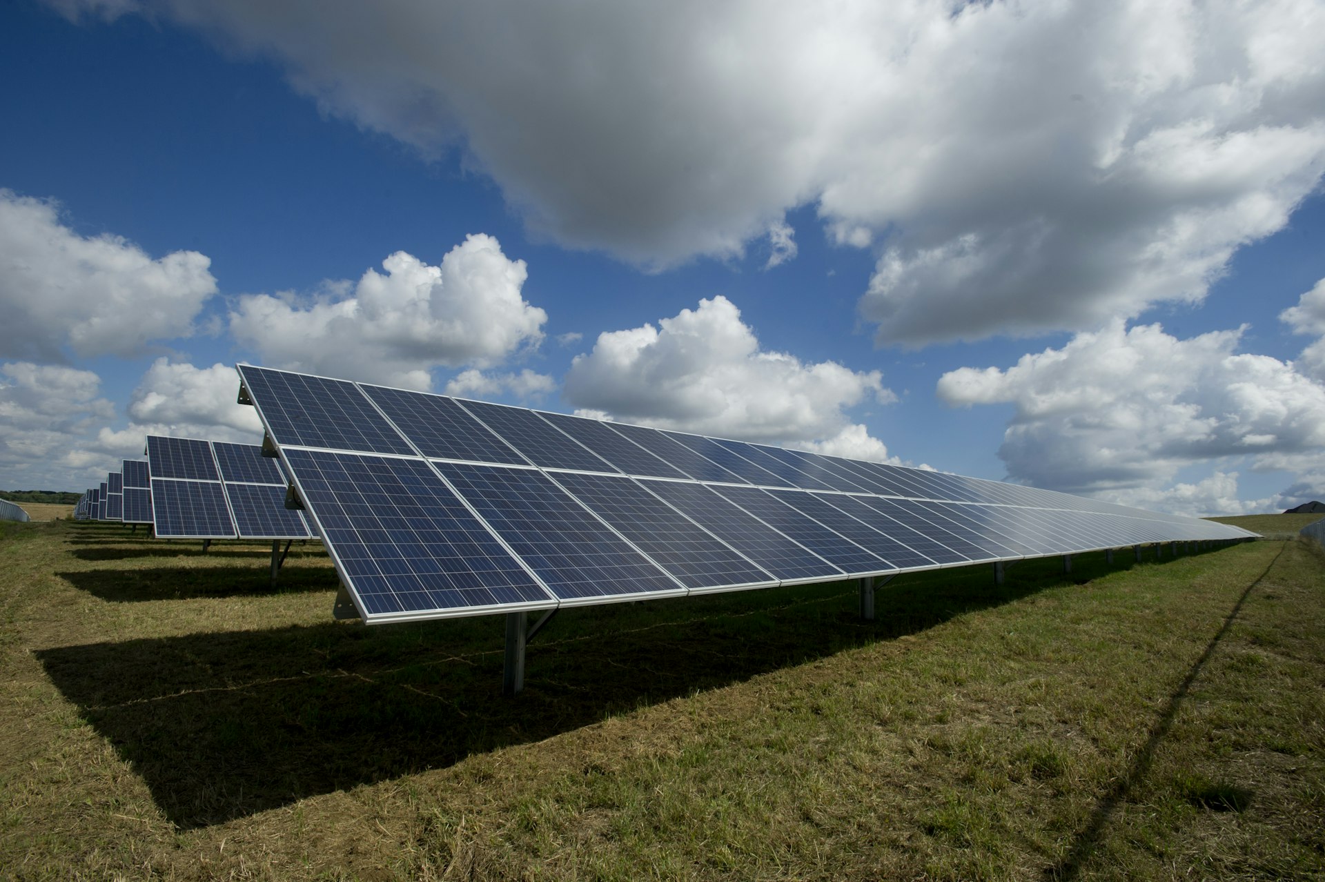 Photovoltaic solar panels in front of the Spanish mountain range at sunrise